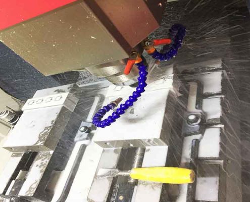 CNC machine cutting a metal component