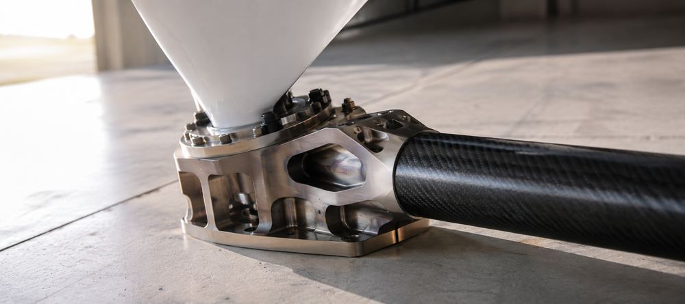 Machined titanium eVTOL rotor arm node with a carbon fibre arm tube and motor mount